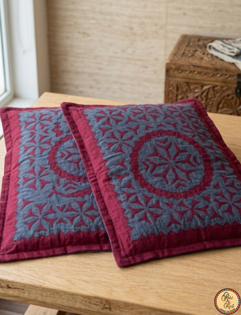 Maroon cotton bedsheet, applique design.